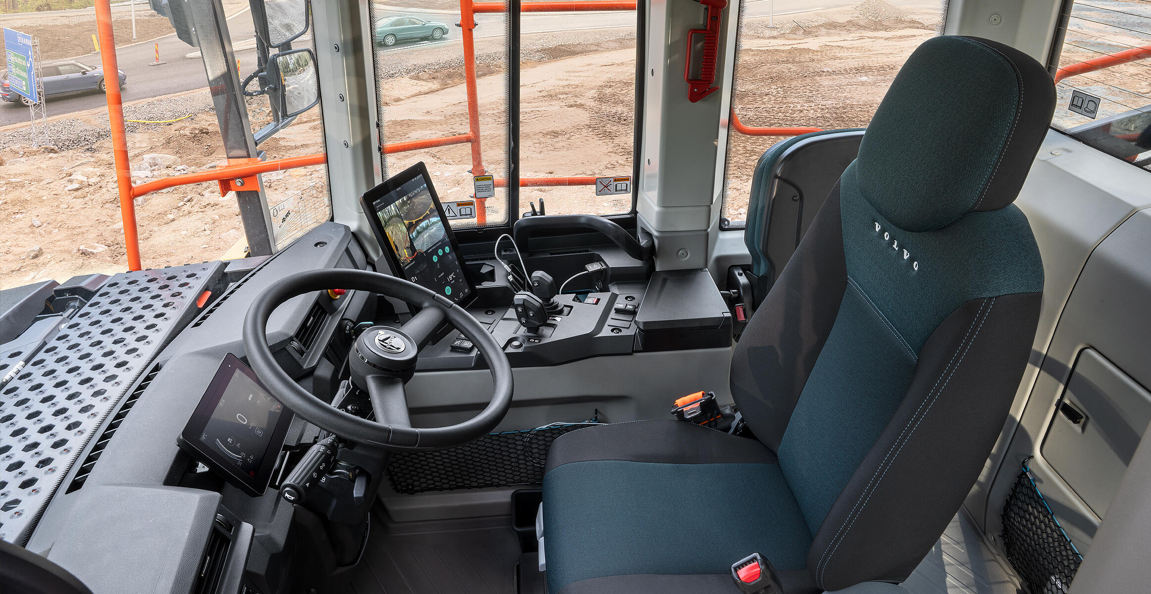 A person comfortably operating a Volvo articulated hauler