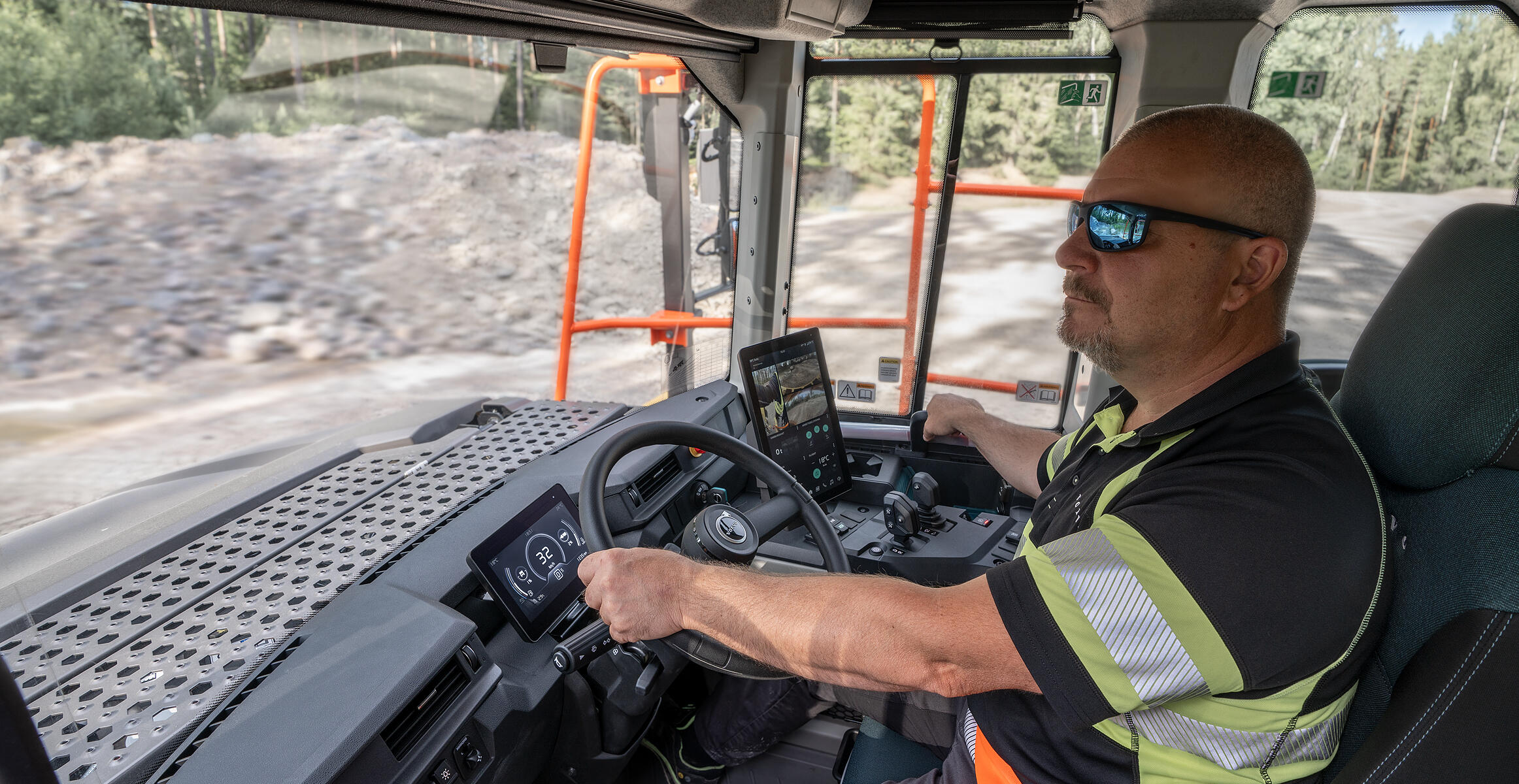 A person operating a Volvo articulated hauler, illustrating enhanced visibility in the new generation dump trucks