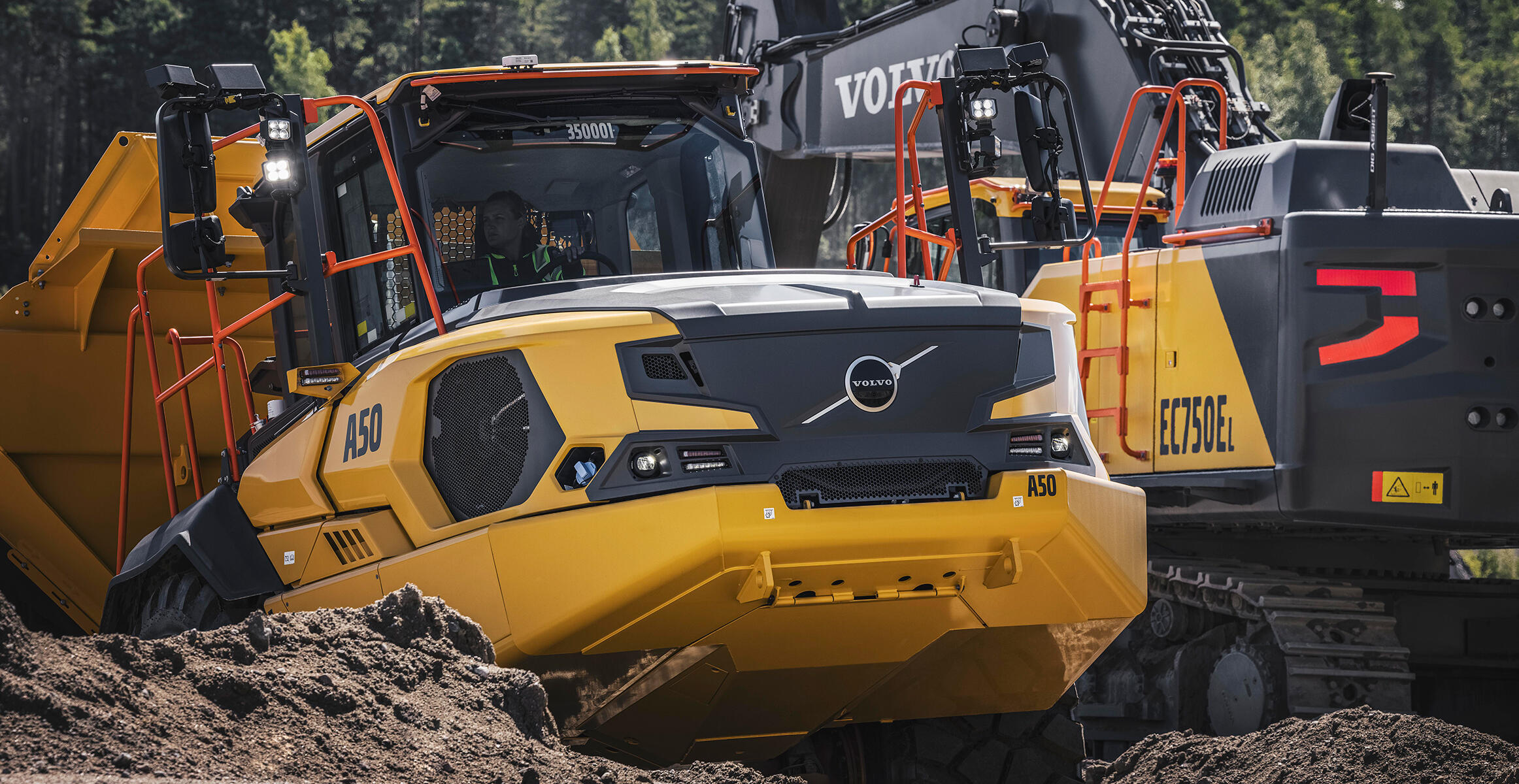 A Volvo A50 full suspension articulated hauler working alongside a Volvo EC750 excavator