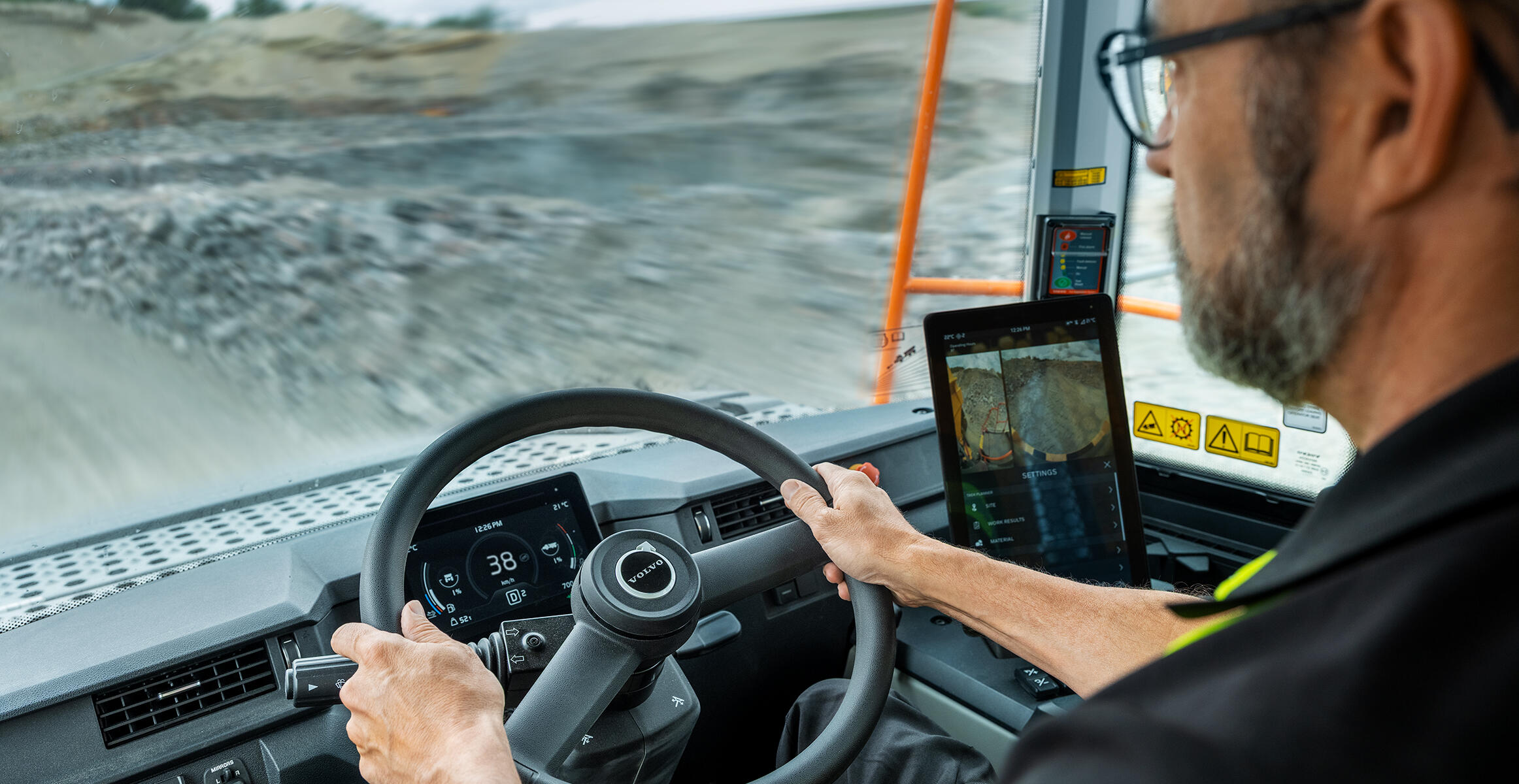 A person operating a Volvo articulated hauler, illustrating enhanced visibility in the new generation dump trucks