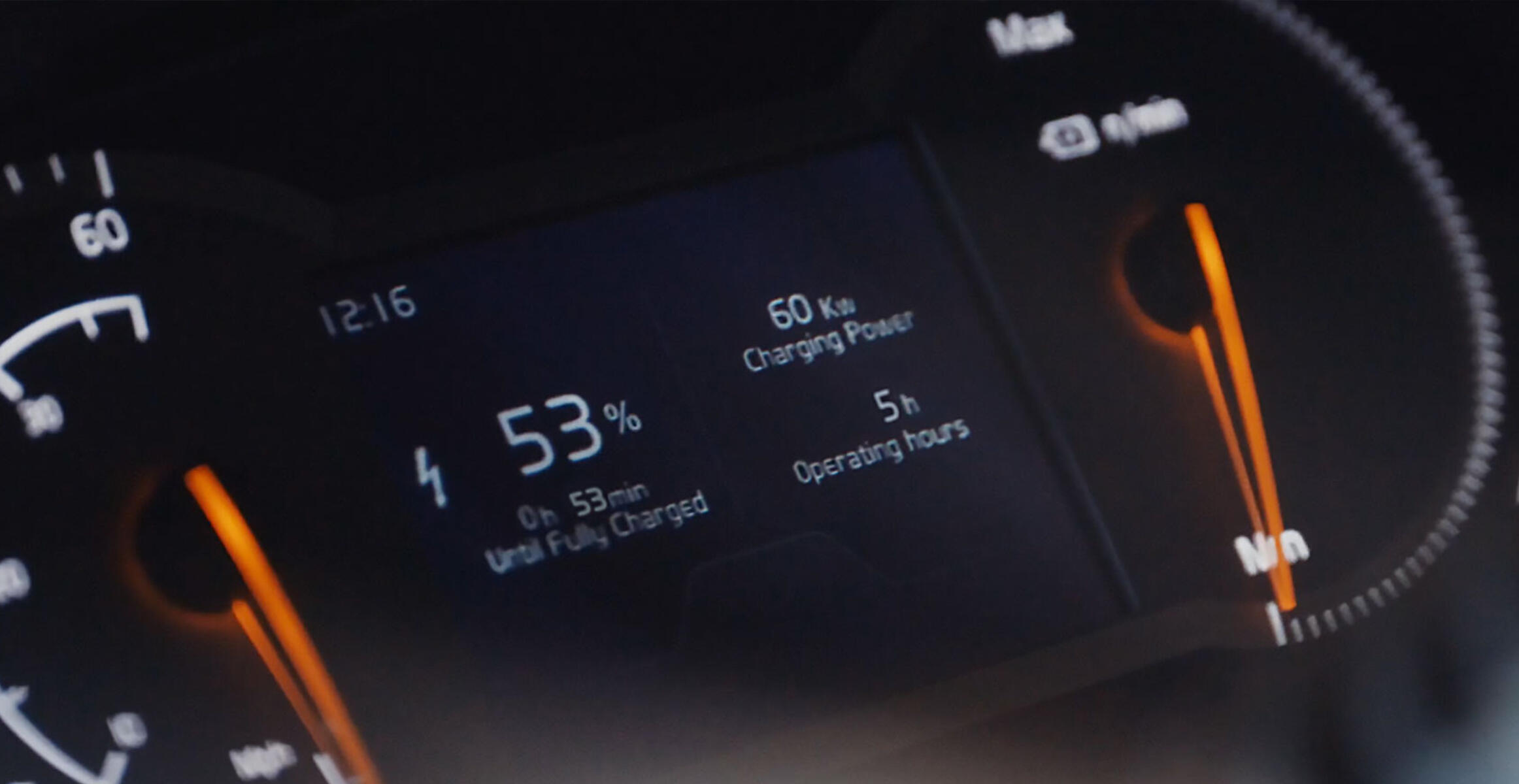Close-up of Volvo L120 Electric wheel loader's digital dashboard showing 53% battery level, 5 hours operating time, 60 kW charging power highlighting reliable electric runtime.
