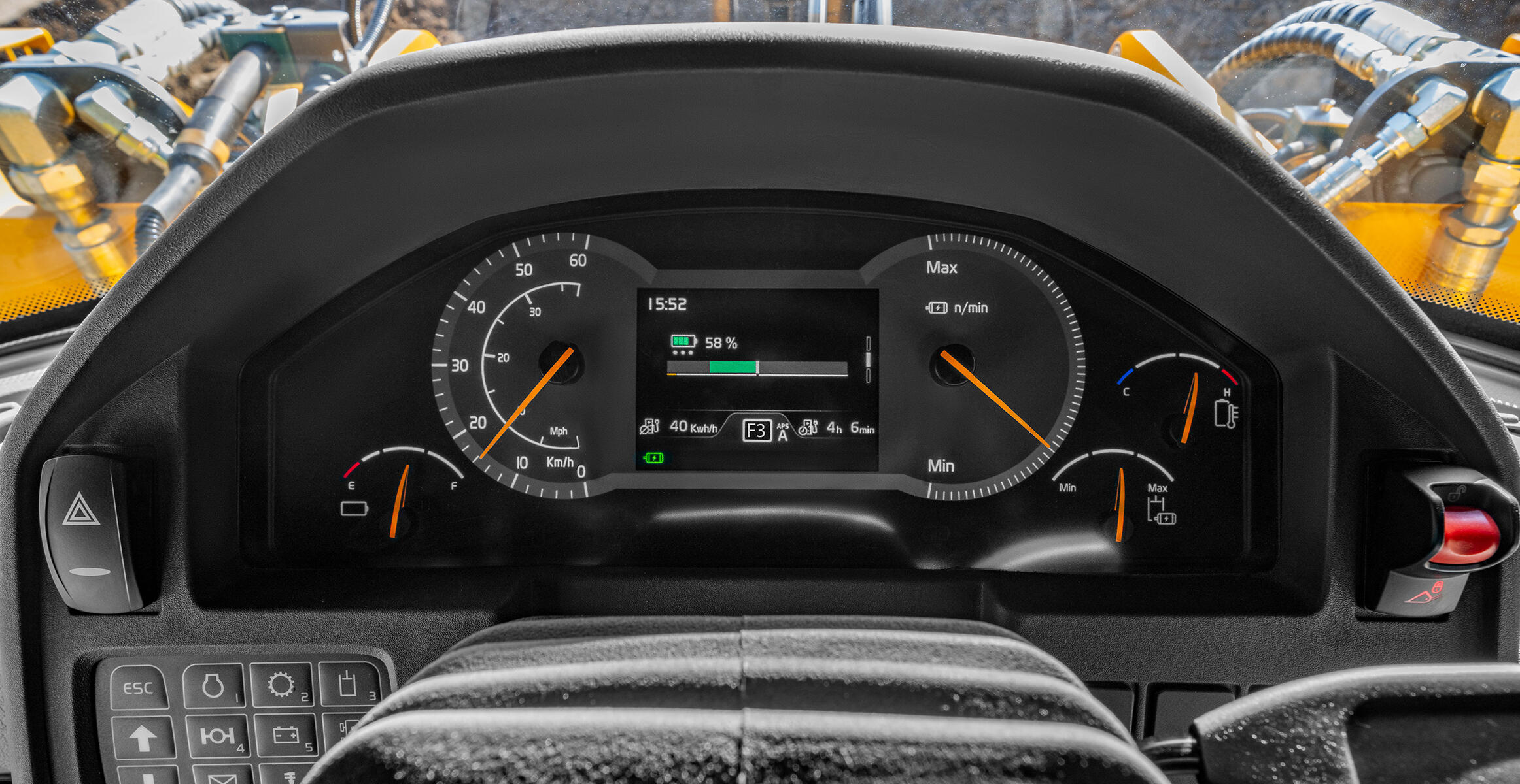 A close-up view of a Volvo L120 Electric Wheel Loader's control panel, highlighting the energy recovery function display  emphasizing its advanced technology in a construction or quarry environment.