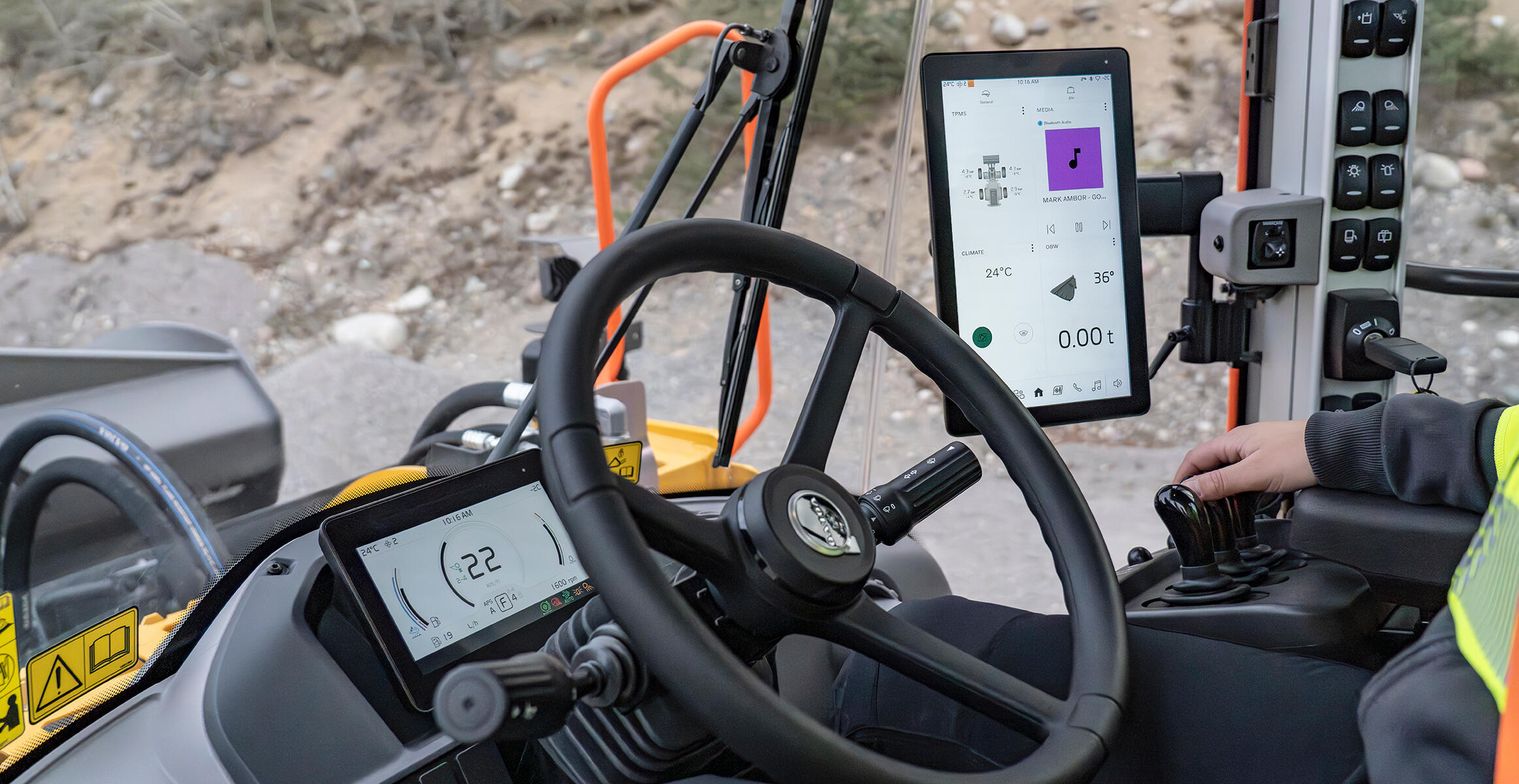 Close up of operator hand on controls of Volvo L220 wheel loader