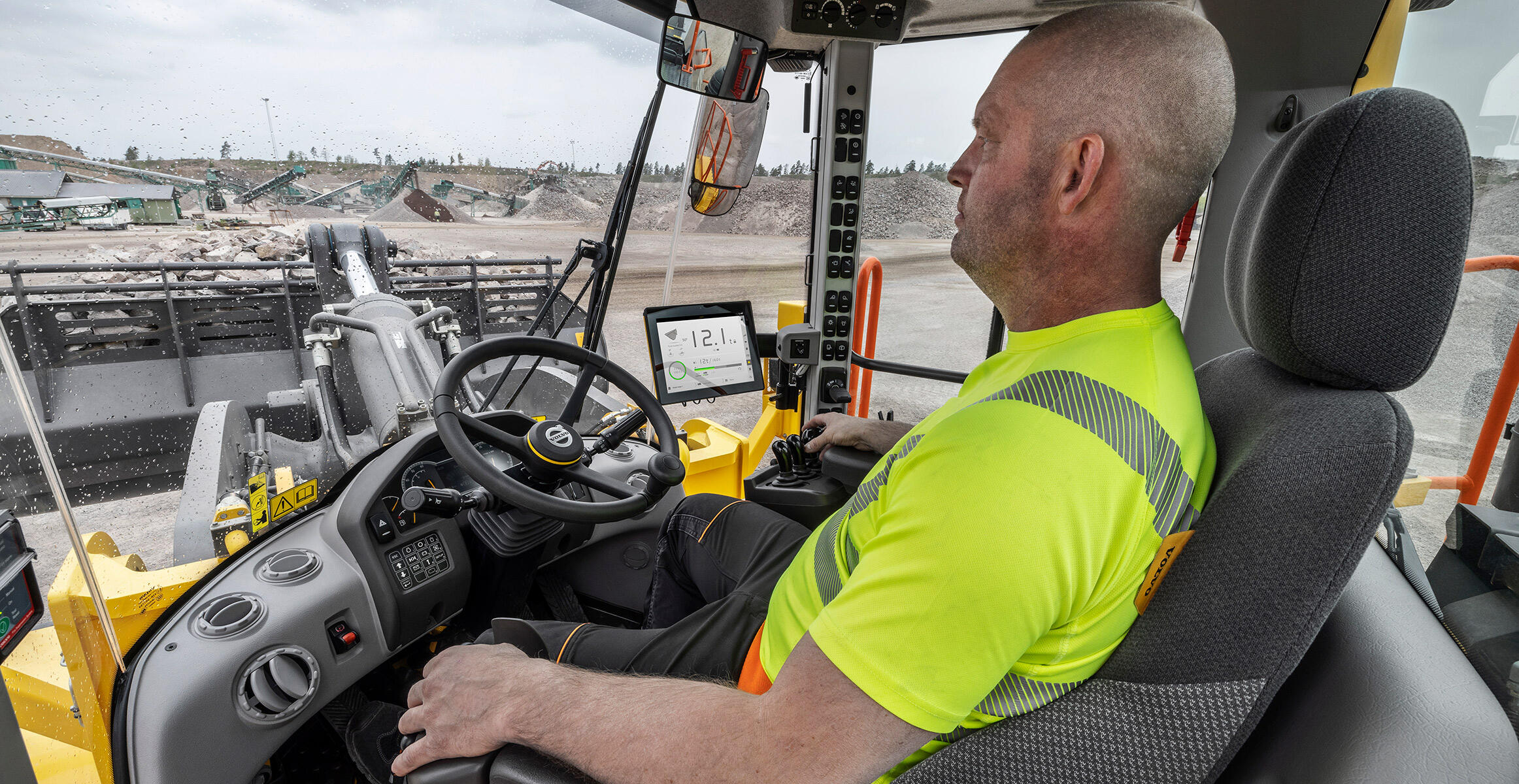 Side  view of the L350H cabin showing the Co-pilot device with the On-Board Weighing app.