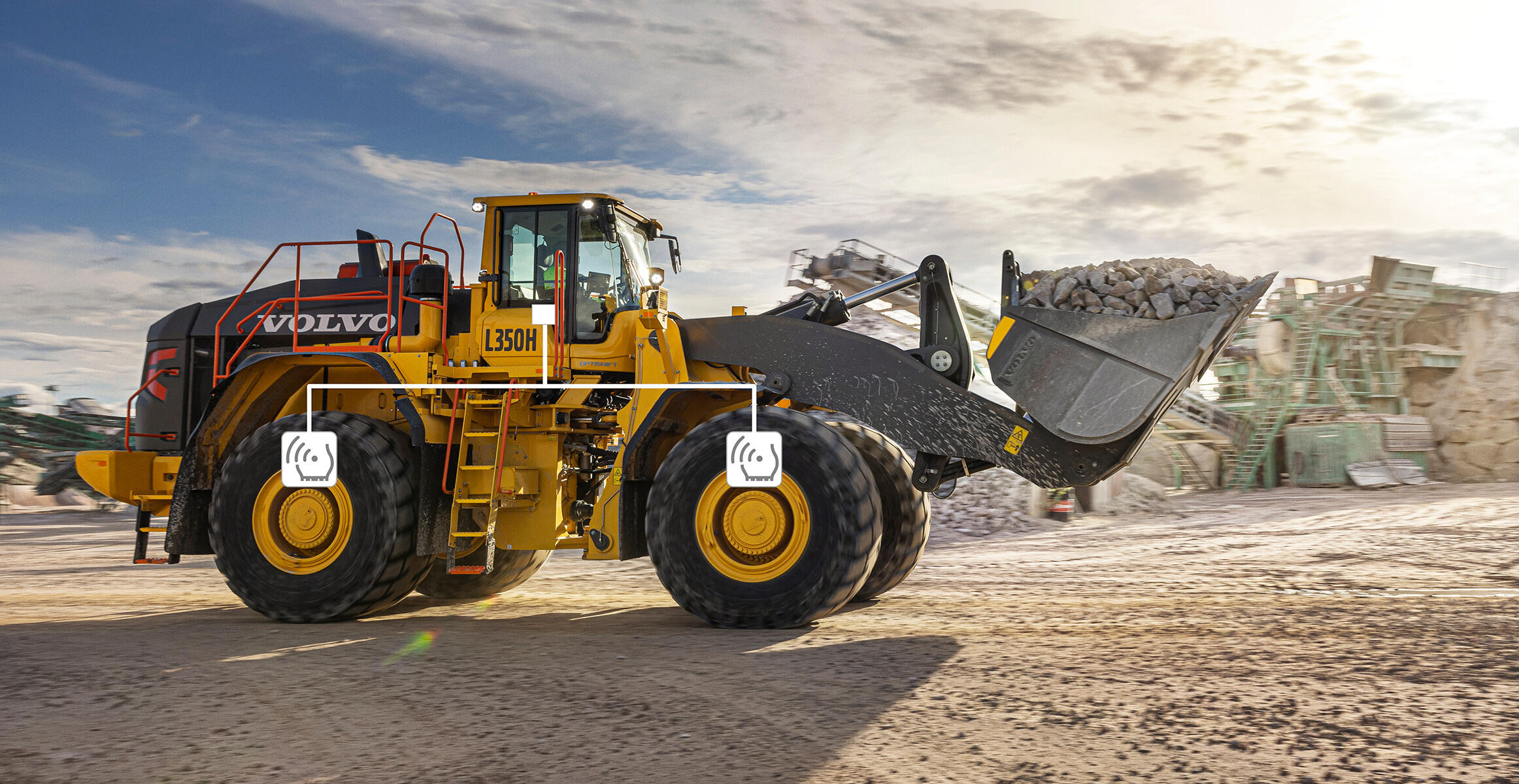 Side  view of a Volvo L350H equipped with the TPMS system giving to the operator real time  tires pressures