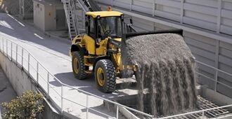 The Volvo L45H navigating through confined spaces, emphasizing its agility and precision.