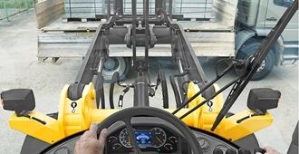 Interior view of the Volvo L45H operator cabin, showing ergonomic controls and excellent visibility.
