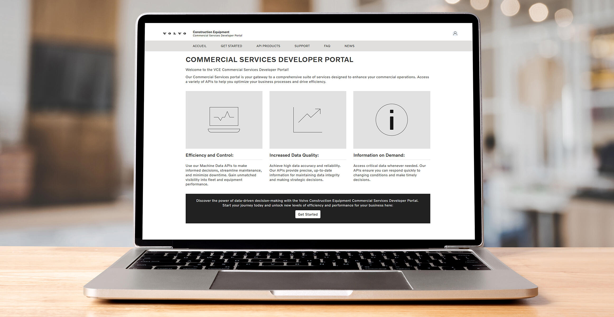 Laptop displaying Volvo Construction Equipment Commercial Services Developer Portal homepage with three service features