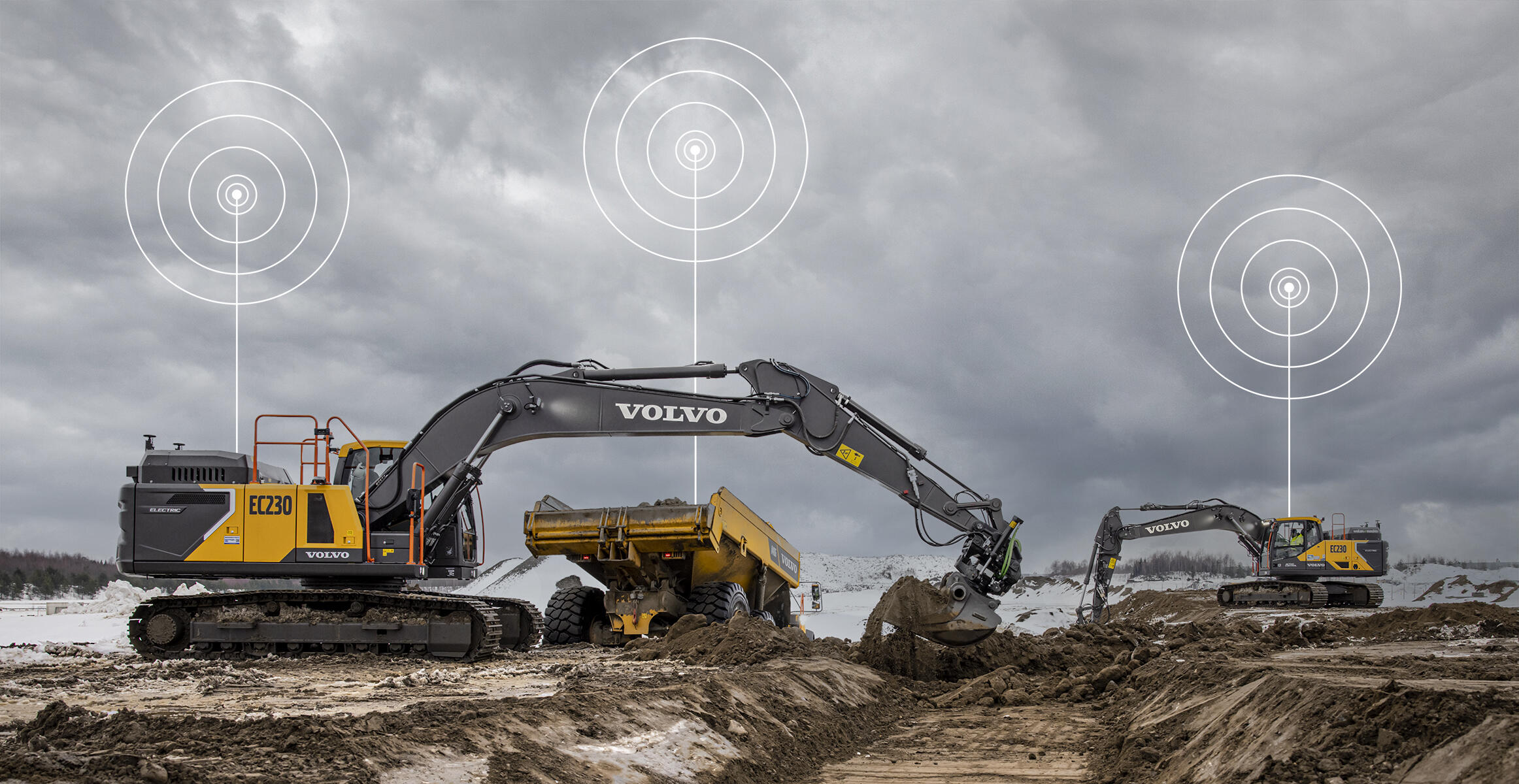 Volvo excavators at construction site with wireless signal icons indicating connectivity technology under overcast sky