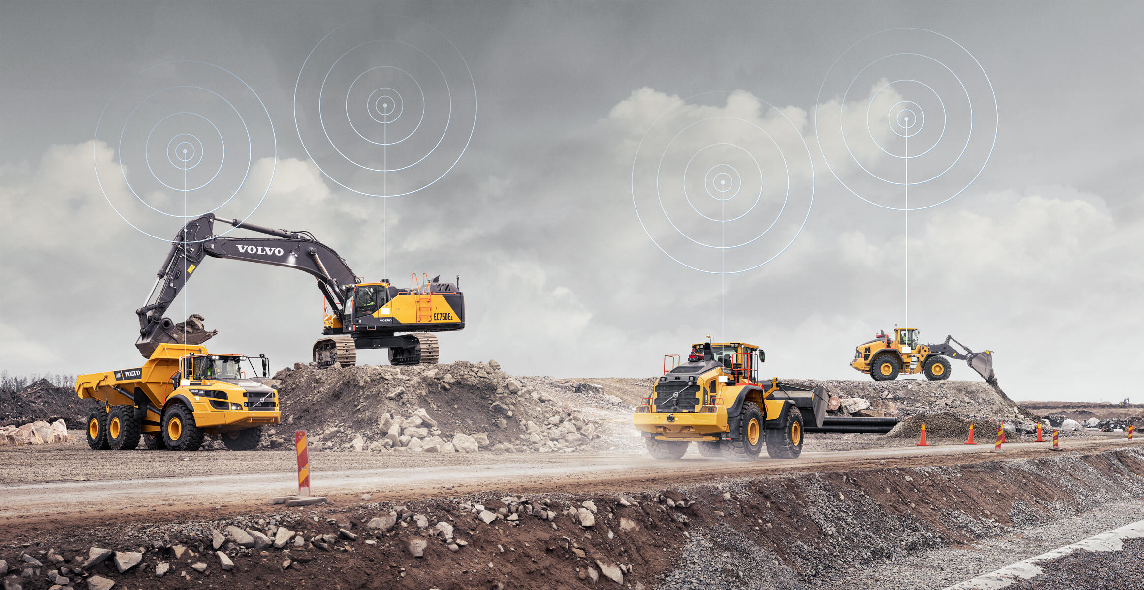 Volvo connected construction equipment with wireless connectivity symbols at job site