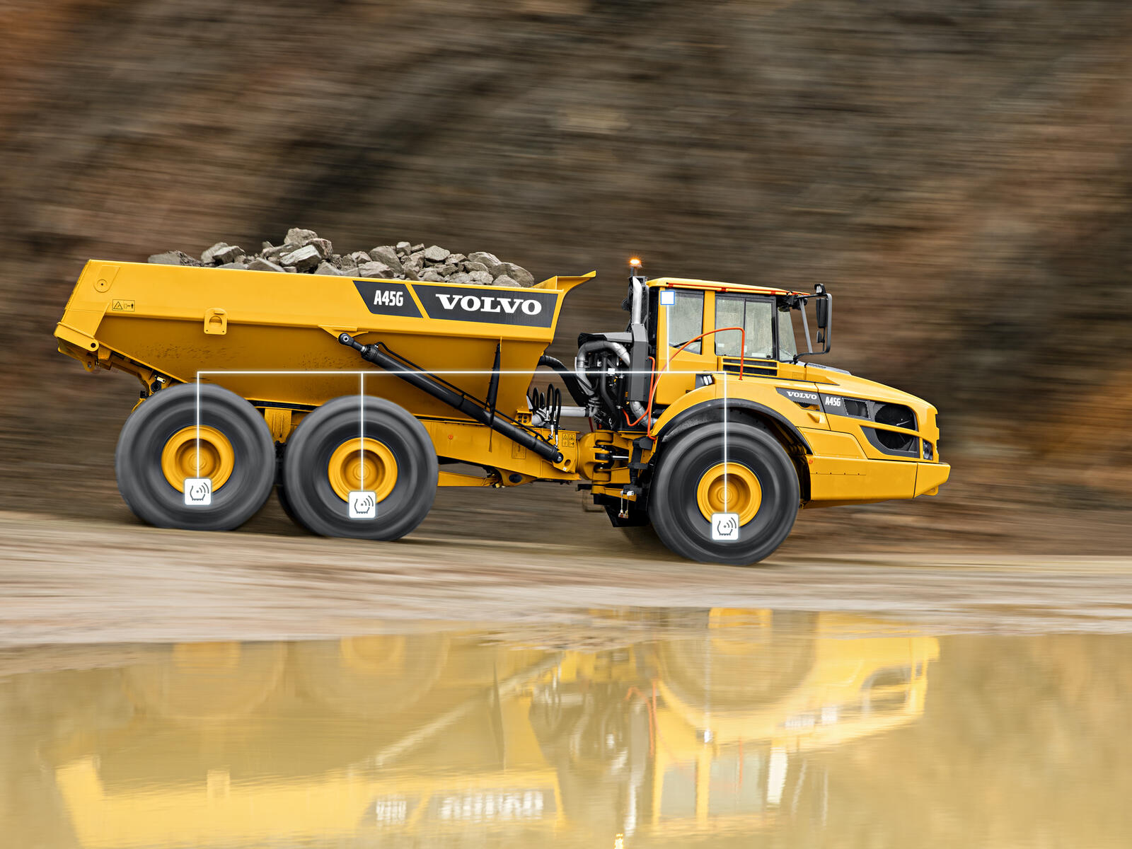 Volvo A45G articulated dump truck hauling rocks on construction site