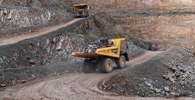 2 Volvo R60 rigid haulers transporting stones to the crusher.