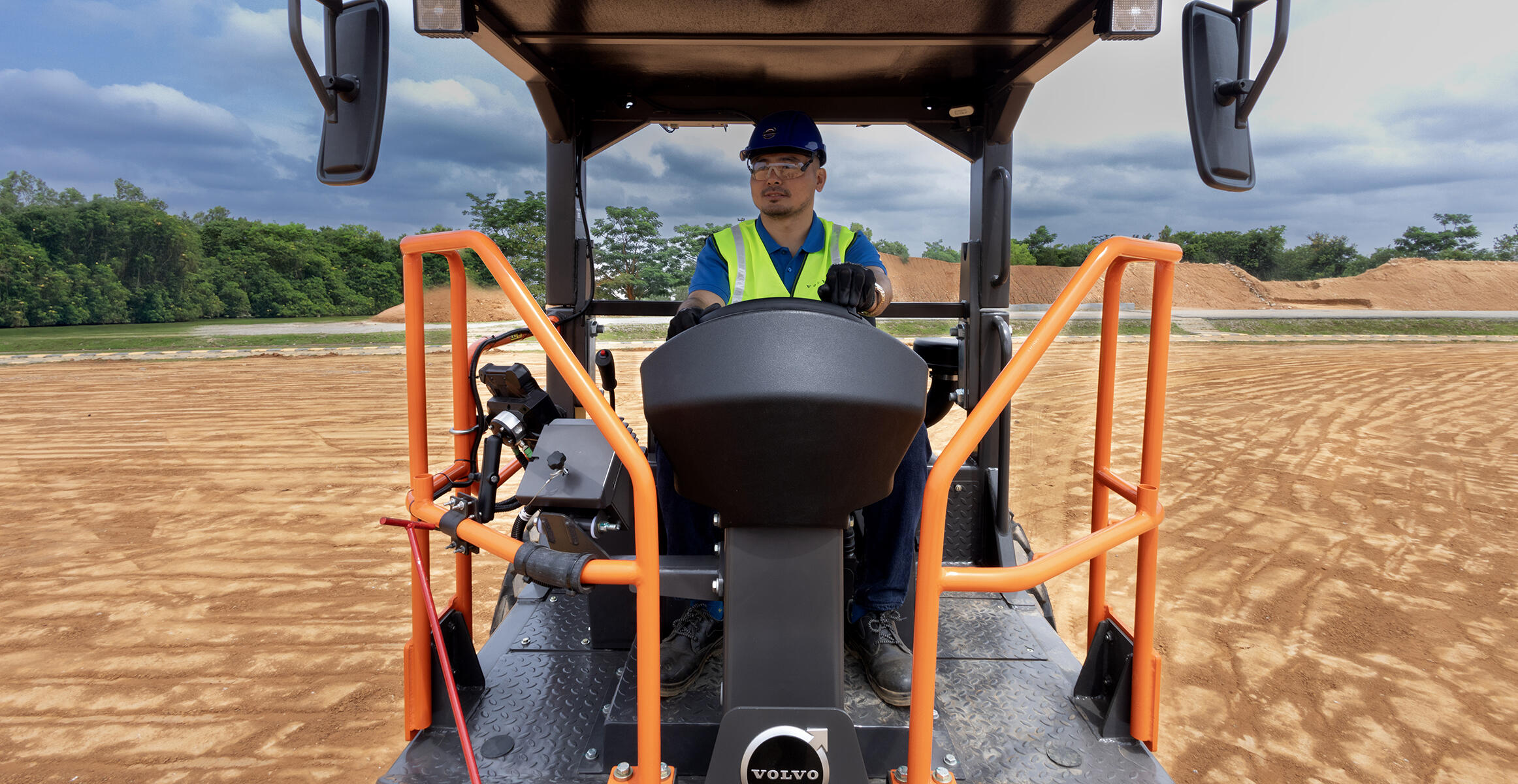 Close view of the large orange handrails and rops protection on a SD120 Volvo soil compactor.