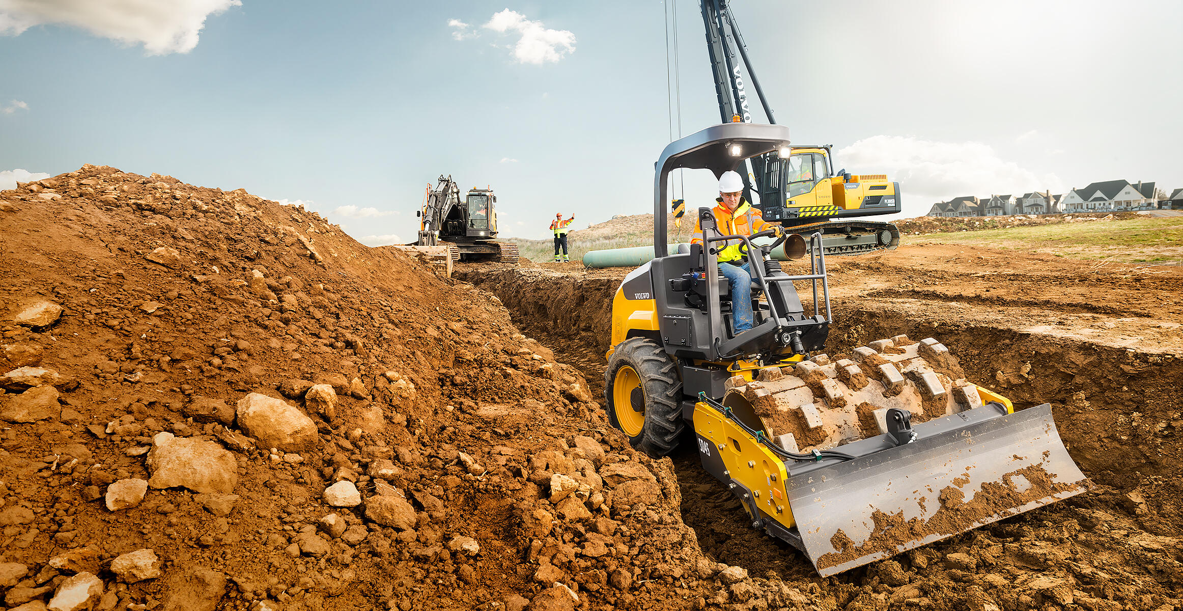 Front view of a SD45B soil compactor with blade and footpad options