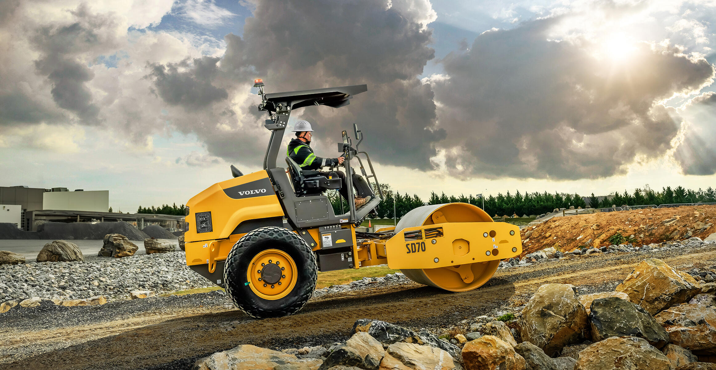 Side view of a Volvo SD70 compacting soil on a slope