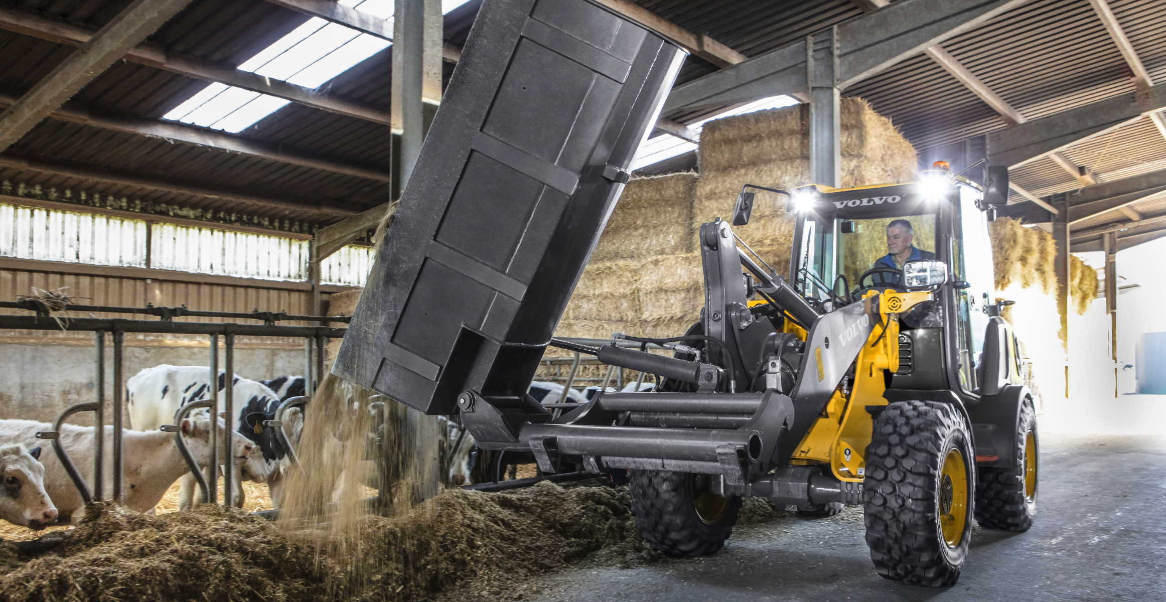 Wheel loader working inside a barn