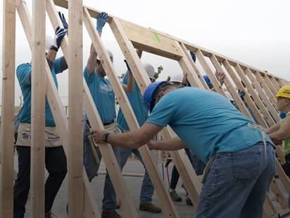 Volvo employees helping out with construction 