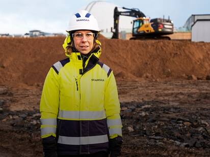 Woman in hardhat at a construction site