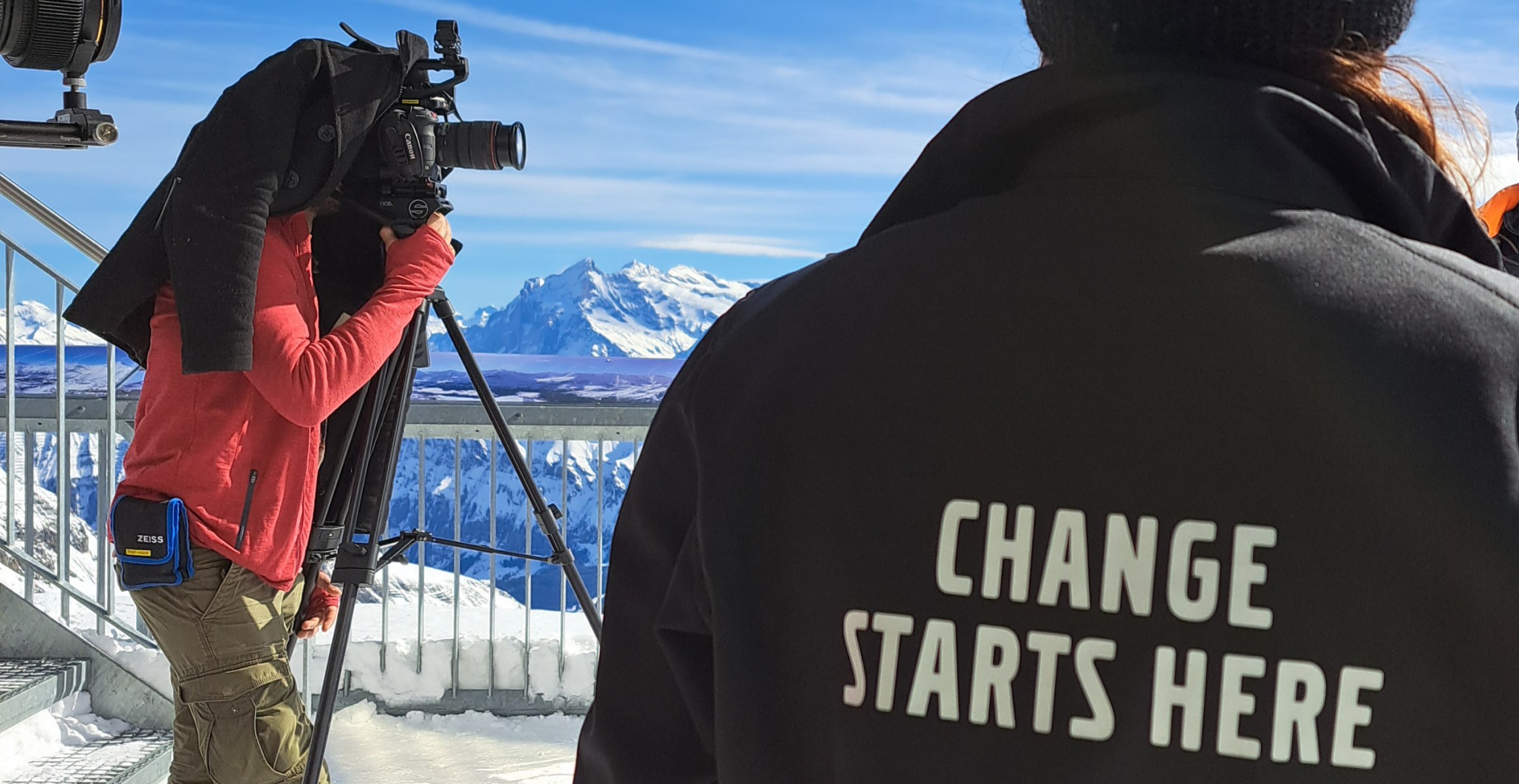 Person taking photos on a mountaintop 