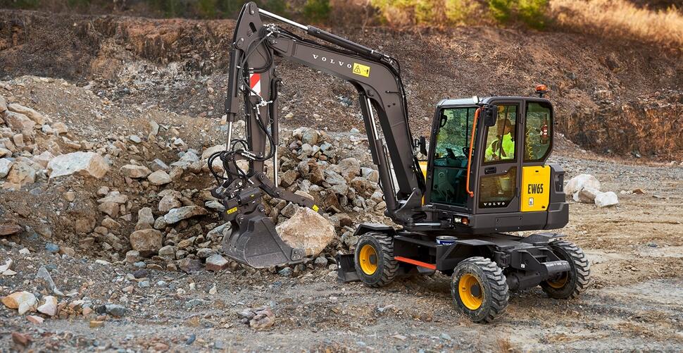 Volvo wheeled excavator operating in rocky quarry terrain