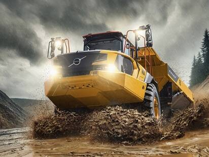 Volvo A50 articulated hauler truck wildly burst through water.