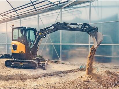 Electric excavator working indoor