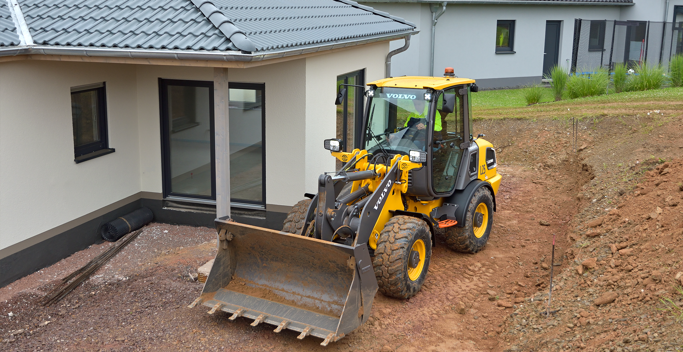 Electric wheel loader in gardening and landscaping