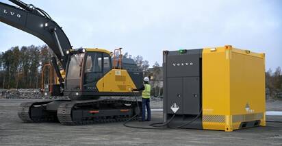 Volvo power unit charging electric excavator in remote and off-grid location. 