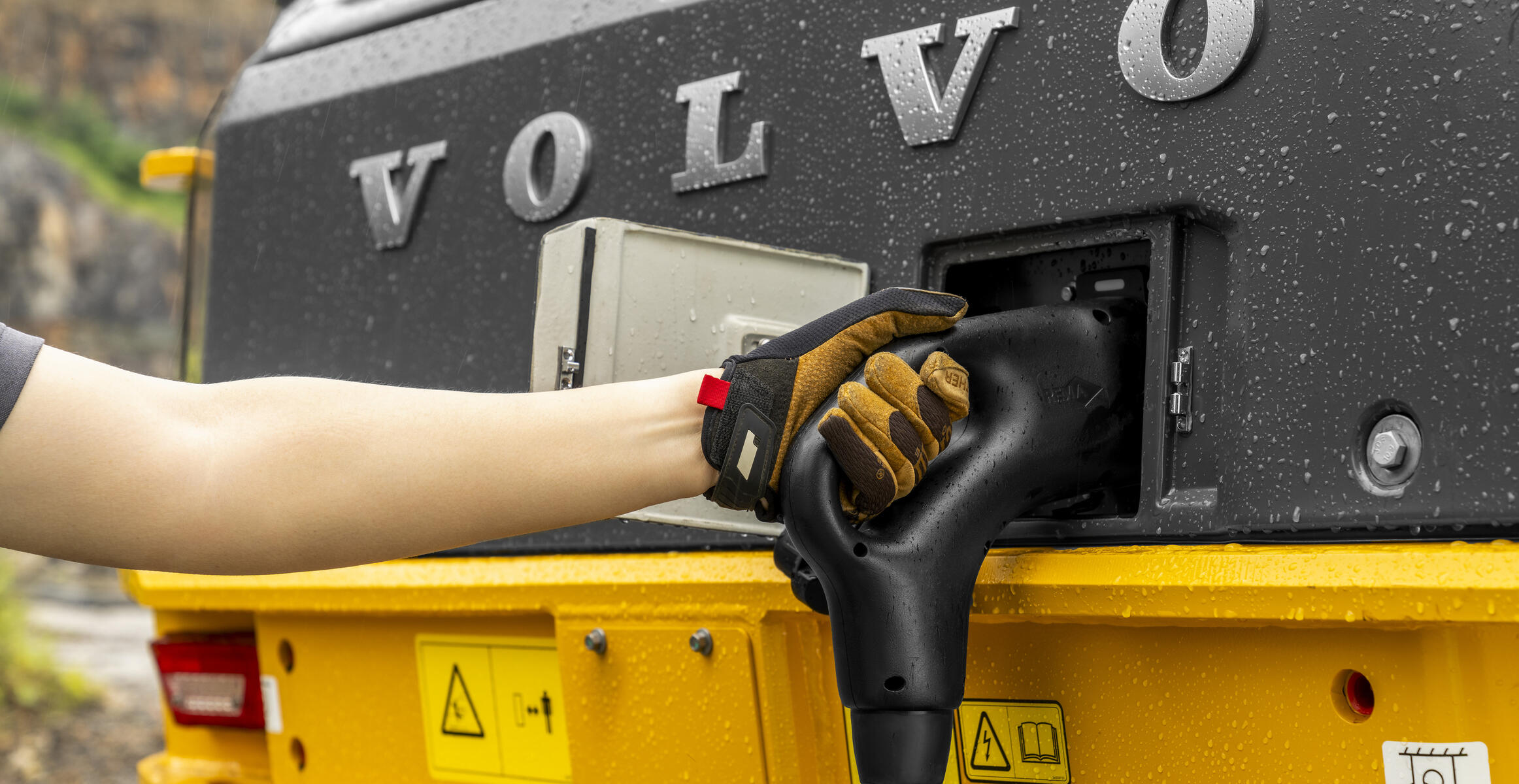 Volvo electric wheel loader being plugged into charging.