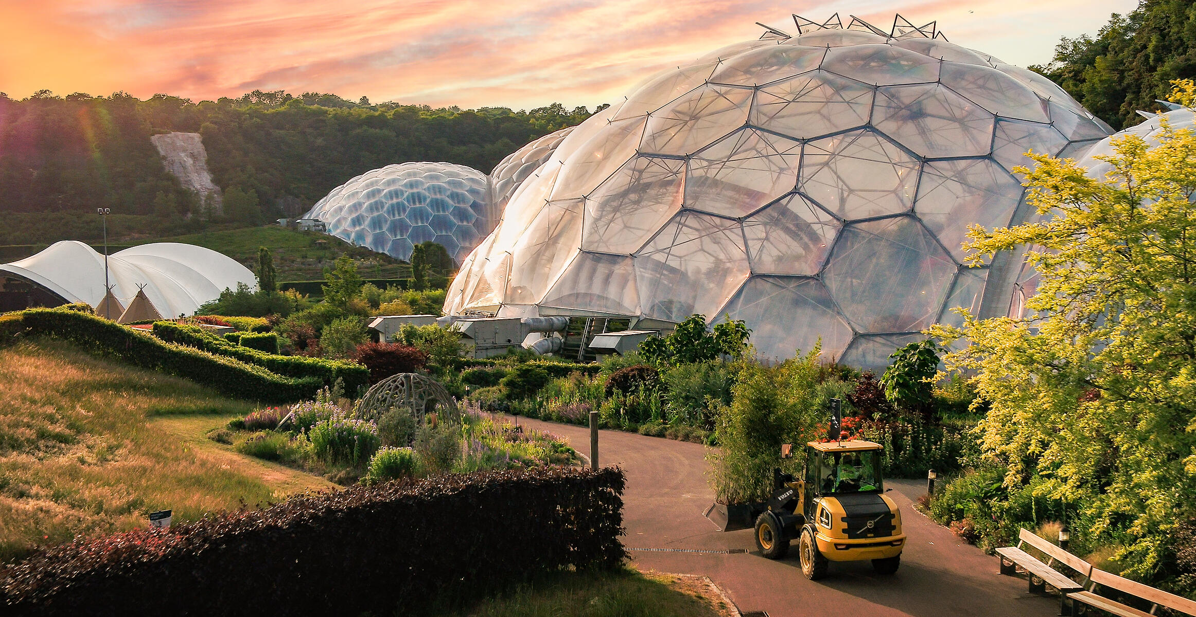 Electric wheel loader doing landscaping at the Eden Project biome domes in Cornwall, England.