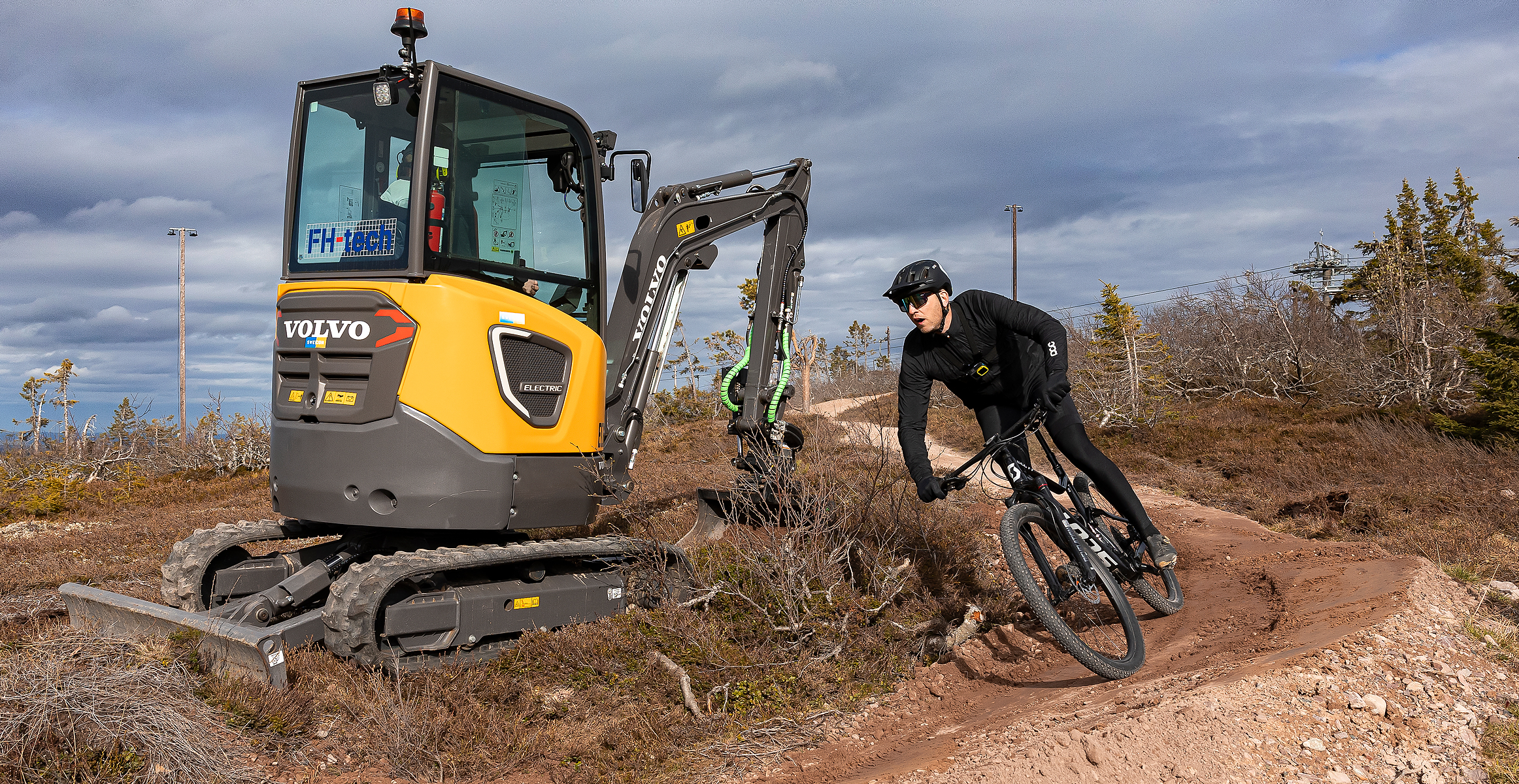Electric excavator working at SkiStar building a mountain bike trail