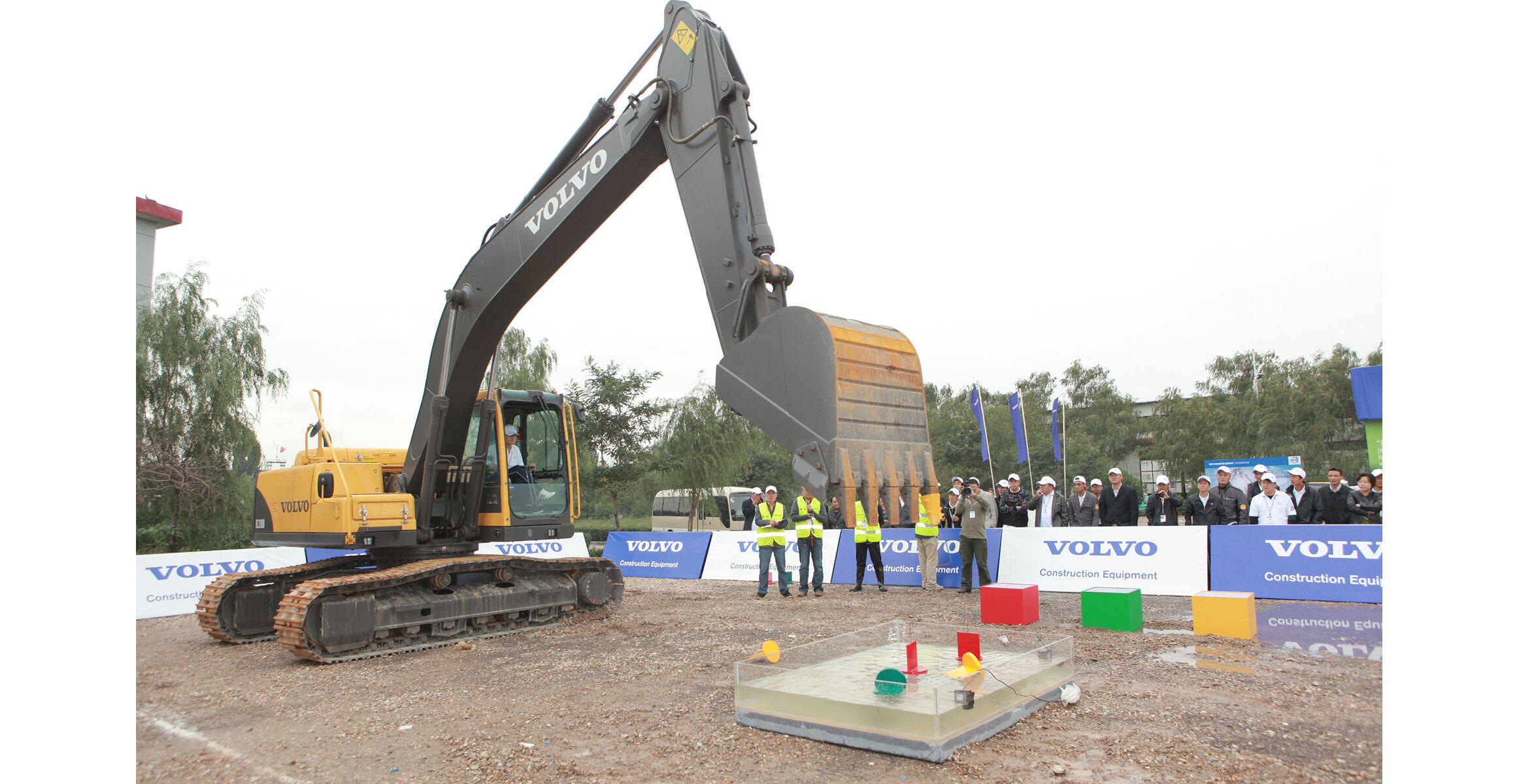 The operator of a Volvo EC210B crawler excavator participates in a test of skill and precision during Operator Idol.
