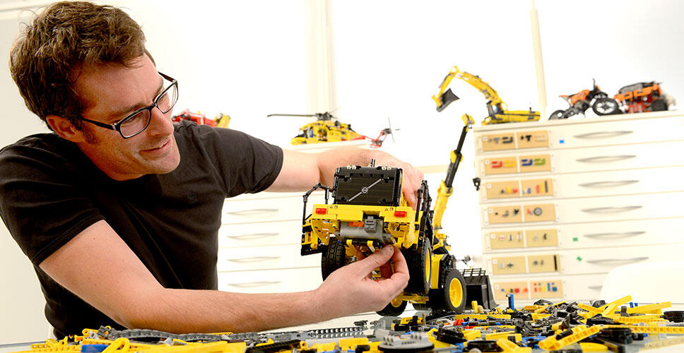 LEGO® Technic design manager, Jeppe Jul Jensen assembles the model Volvo L350F wheel loader.
