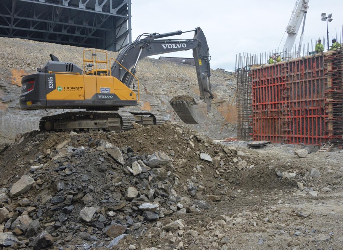 Volvo EC350E loading blasted rock