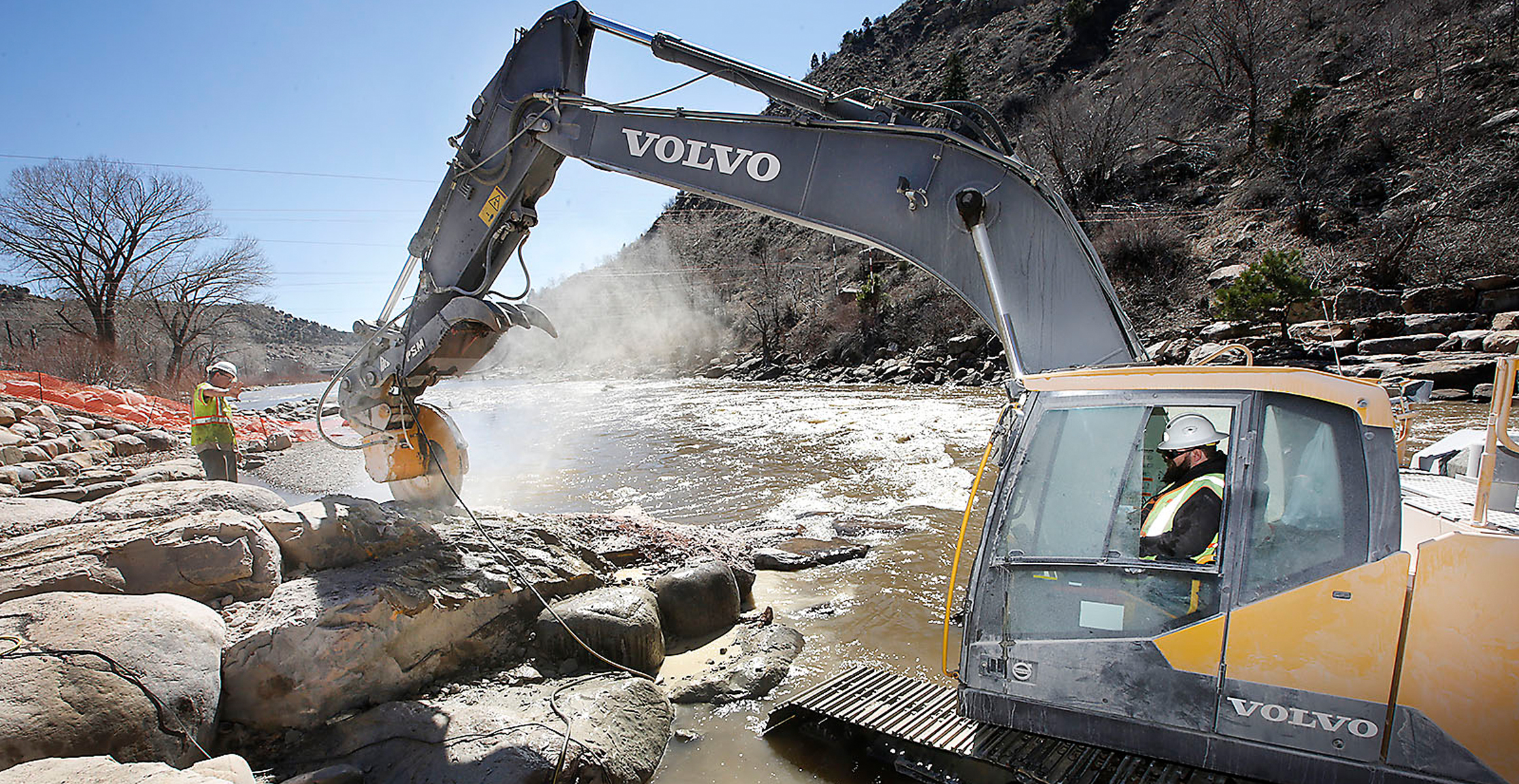 Volvo excavators navigate the Animas River in Colorado