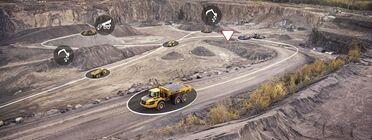 Volvo articulated hauler in quarry with digital icons showing connected equipment locations