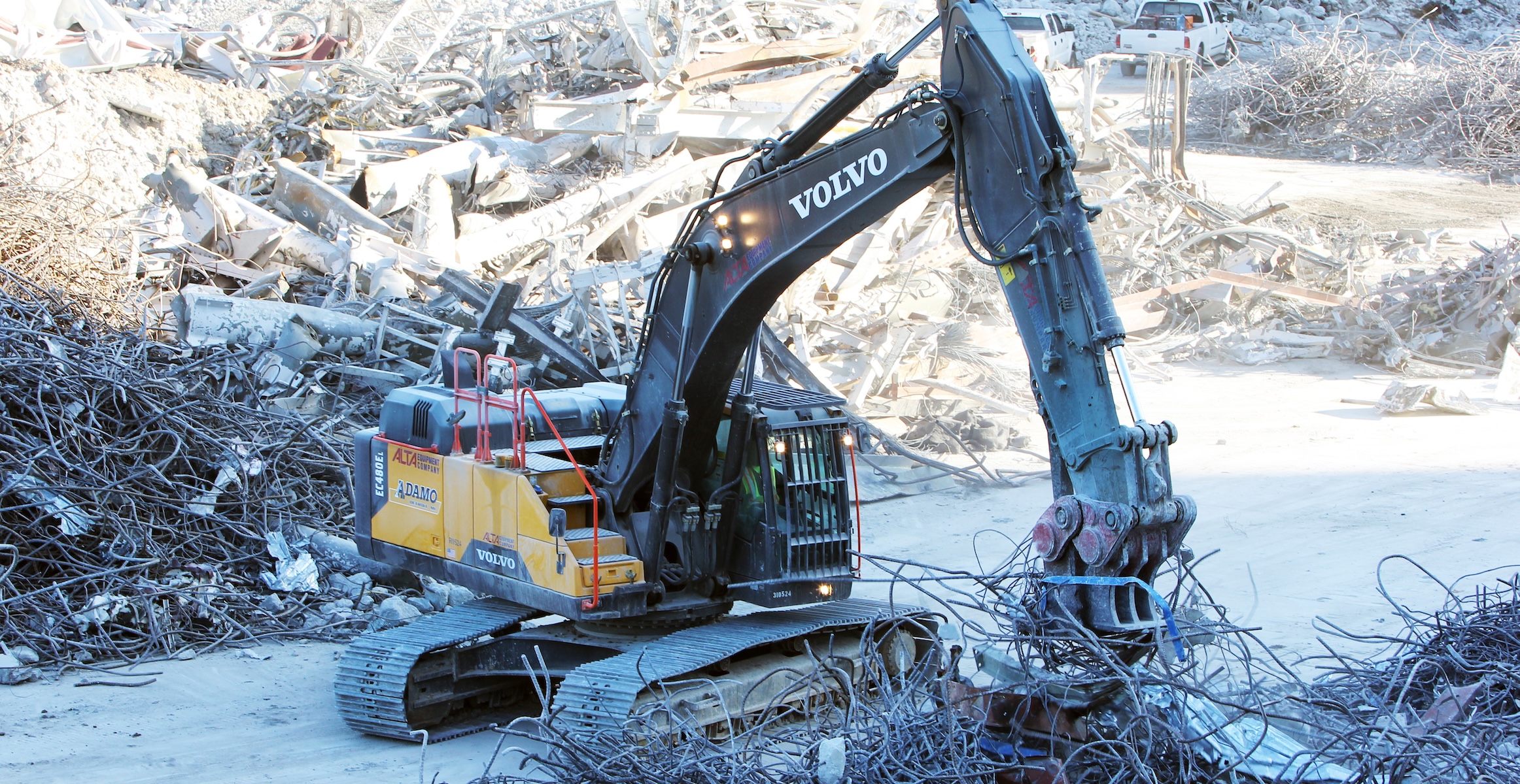 A Volvo factory-fitted demolition excavator sorting debris.