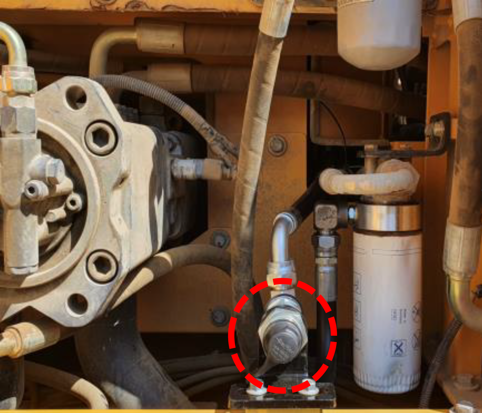The Volvo excavator oil change quick-fit option circled in red.