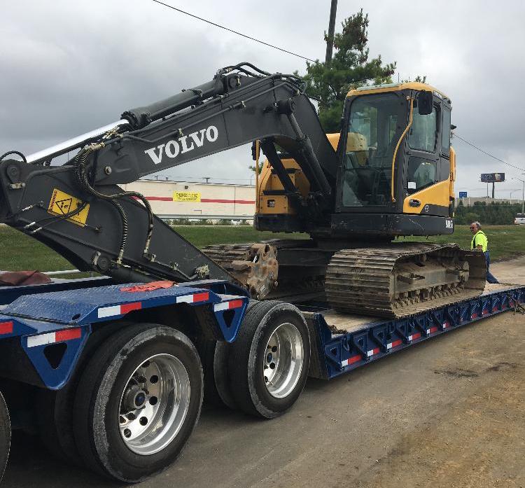 Transporting an excavator on a trailer