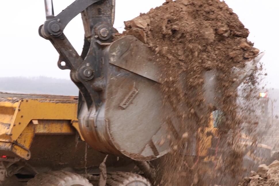 Overloaded excavator bucket
