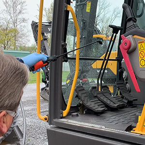 Cleaning floorboards inside the cab