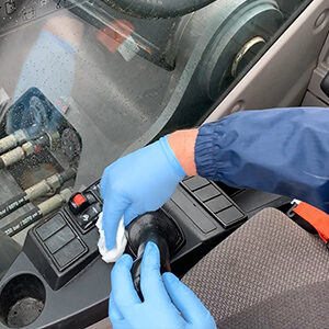 Cleaning the joystick inside of the cab