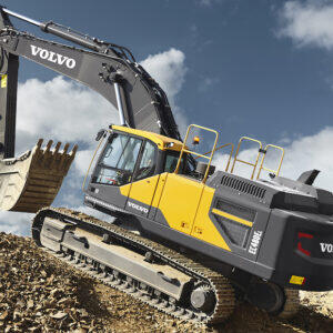 Volvo excavator driving up a slope.