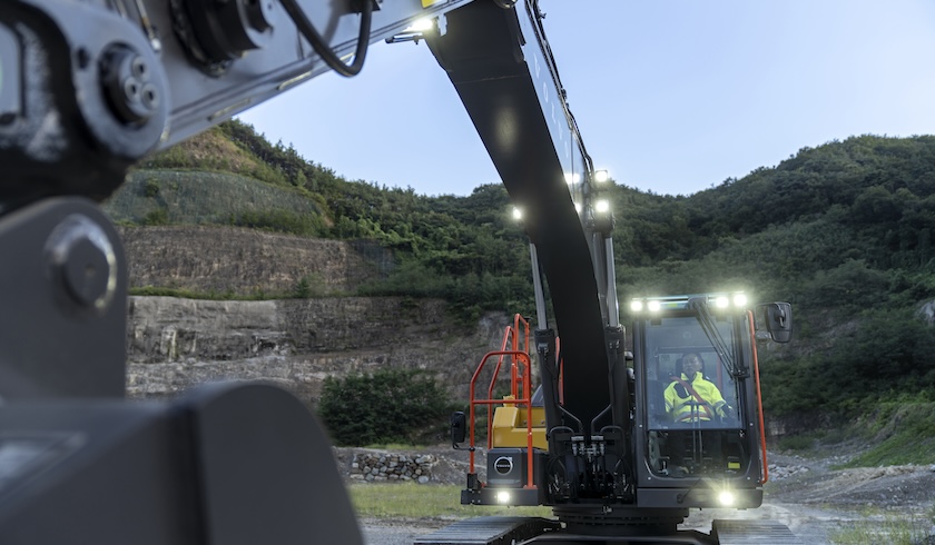 View of additional exterior lights illuminated on new Volvo excavators.