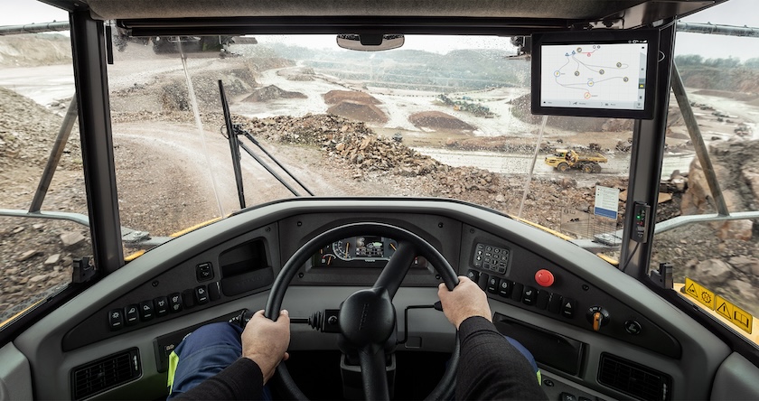View out the front of an articulated hauler from an operator’s perspective.