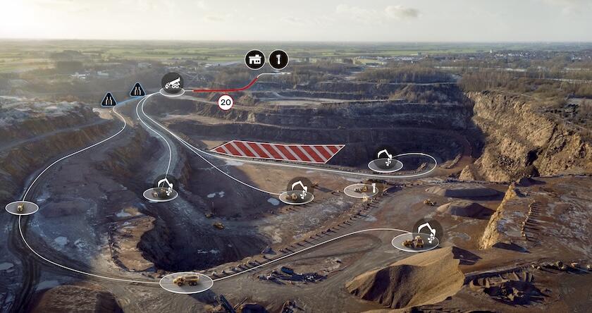 An overhead view of a surface mine with various machines circled and haul roads mapped to show how Volvo Haul Assist mapping works.