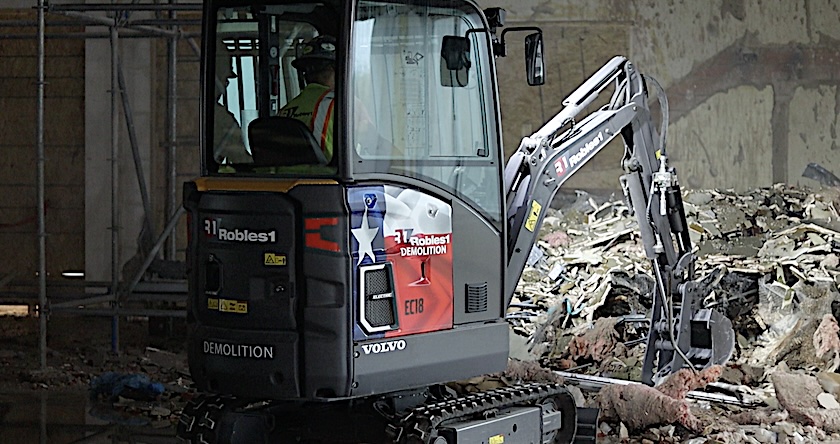 A Volvo EC18 Electric excavator working in indoor demolition.