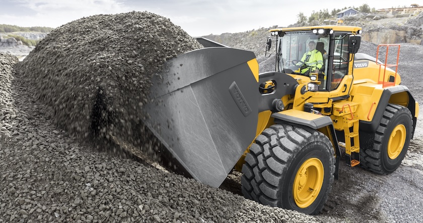 An operator using Auto Bucket Fill on a Volvo wheel loader.