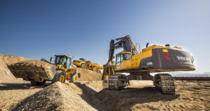 Volvo heavy equipment working together.