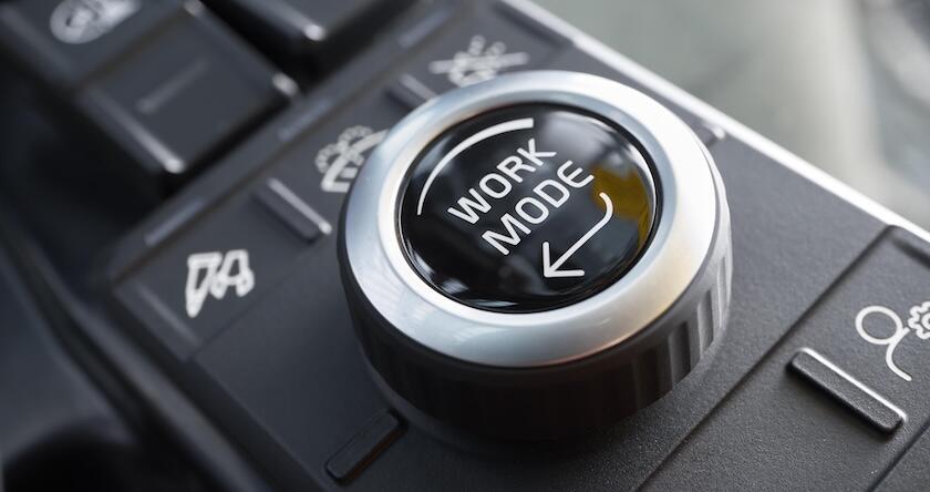 The dial to adjust the work mode on a Volvo excavator.
